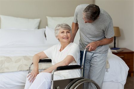 Retired woman in her wheelchair with her husband Stock Photo - Budget Royalty-Free & Subscription, Code: 400-04326706
