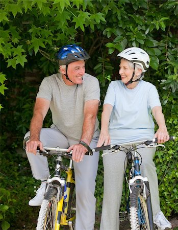 Senior couple mountain biking outside Stock Photo - Budget Royalty-Free & Subscription, Code: 400-04326767