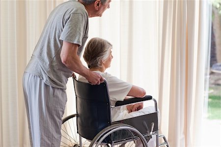 Retired couple looking out the window Stock Photo - Budget Royalty-Free & Subscription, Code: 400-04327093