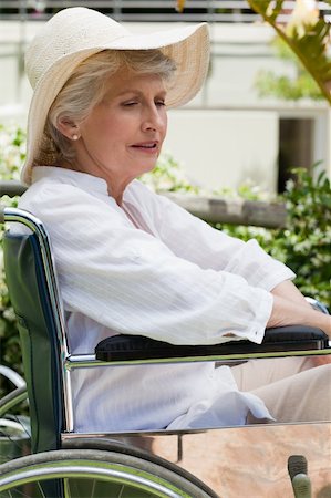 Mature woman in her wheelchair in the garden Stock Photo - Budget Royalty-Free & Subscription, Code: 400-04327104