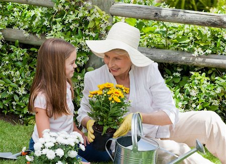 Grandmother with her granddaughter working in the garden Stock Photo - Budget Royalty-Free & Subscription, Code: 400-04327122