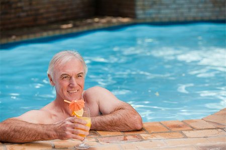 Senior man in his swimming pool Stock Photo - Budget Royalty-Free & Subscription, Code: 400-04327284