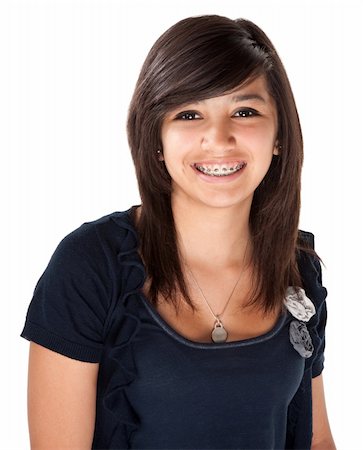Cute Hispanic teenage girl with braces and a big smile Stock Photo - Budget Royalty-Free & Subscription, Code: 400-04328005
