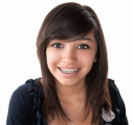 Cute Hispanic teenage girl smiling with braces on a white background Stock Photo - Budget Royalty-Free & Subscription, Code: 400-04328010