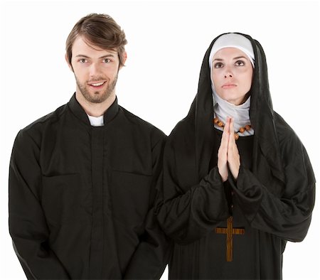 praying catholic nun - Young easygoing priest with nun praying with white background Stock Photo - Budget Royalty-Free & Subscription, Code: 400-04328037