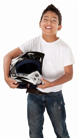 Cute Hispanic youth racer smiling with helmet in hand on white background Photographie de stock - Aubaine LD & Abonnement, Code: 400-04328030