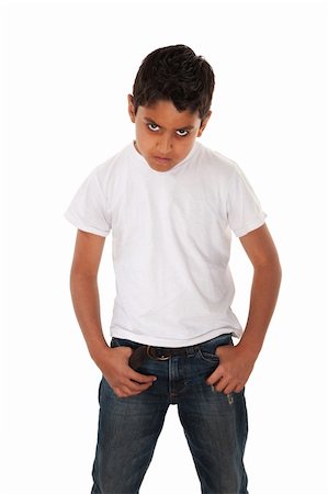 Angry youngster in t-shirt and hands in pockets Photographie de stock - Aubaine LD & Abonnement, Code: 400-04328031