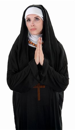 praying catholic nun - Innocent nun with palms together in prayer Stock Photo - Budget Royalty-Free & Subscription, Code: 400-04328079