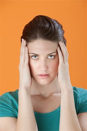 simsearch:400-05388090,k - Stressed out Caucasian woman massaging her temples with fingers Stock Photo - Budget Royalty-Free & Subscription, Code: 400-04328112