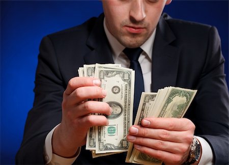 simsearch:400-05718324,k - Businessman counts money Stock Photo - Budget Royalty-Free & Subscription, Code: 400-04320277