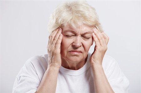 An elderly woman suffering headache Stock Photo - Budget Royalty-Free & Subscription, Code: 400-04320902