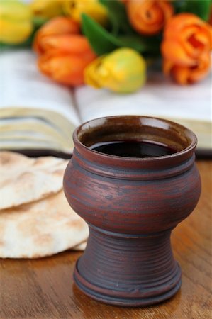 Chalice with red wine, pita bread, Holy Bible and colorful tulips Stock Photo - Budget Royalty-Free & Subscription, Code: 400-04321842