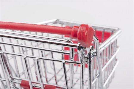 simsearch:400-04321973,k - Empty shopping cart with the red handle on a white background. Stock Photo - Budget Royalty-Free & Subscription, Code: 400-04321973