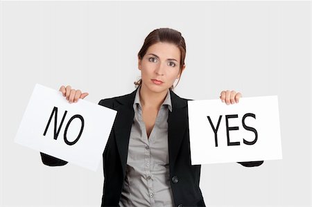 Business young woman trying to make a decision between Yes or No choice Foto de stock - Super Valor sin royalties y Suscripción, Código: 400-04322242