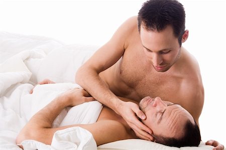 Happy homo couple in a white bed taking care of his boyfriend Stock Photo - Budget Royalty-Free & Subscription, Code: 400-04322402