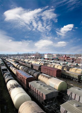 Railroad cars on a railway station. Cargo transportation. Work of industry. Urban scene Stock Photo - Budget Royalty-Free & Subscription, Code: 400-04334256