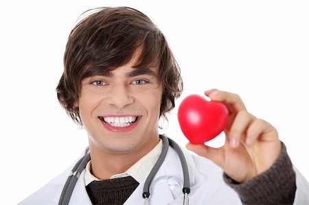 simsearch:400-07222508,k - Happy handsome young male doctor holding heart shape toy, isolated on white Photographie de stock - Aubaine LD & Abonnement, Code: 400-04335235