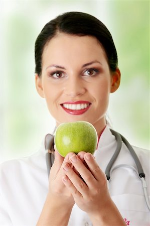 food specialist - Healthy eating or lifestyle concept. Smiling woman doctor with a green apple. Stock Photo - Budget Royalty-Free & Subscription, Code: 400-04336219