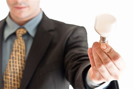 simsearch:400-05744172,k - Isolated business man with light bulb in hand Stock Photo - Budget Royalty-Free & Subscription, Code: 400-04332881