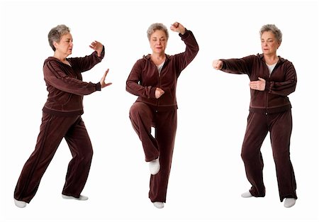 Beautiful Senior woman doing Tai Chi exercise to keep her joints flexible, isolated. Stock Photo - Budget Royalty-Free & Subscription, Code: 400-04344219