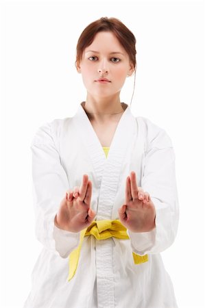 simsearch:400-04347301,k - Attractive young sexy women in a karate pose isolated on white Photographie de stock - Aubaine LD & Abonnement, Code: 400-04346041