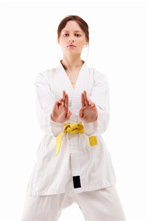 simsearch:400-04347301,k - Attractive young sexy women in a karate pose isolated on white Photographie de stock - Aubaine LD & Abonnement, Code: 400-04346042