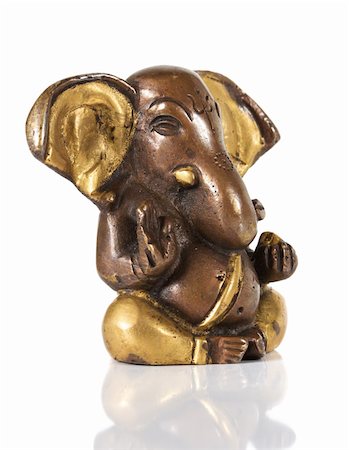 elephant god - Ancient Statuette of Ganesha isolated on a white background Stock Photo - Budget Royalty-Free & Subscription, Code: 400-04346595