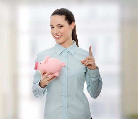 rich women with money laughing - Businesswoman holding piggy bank. Stock Photo - Budget Royalty-Free & Subscription, Code: 400-04346632