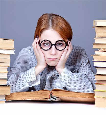 simsearch:400-04860880,k - The young teacher in glasses with books. Studio shot. Stock Photo - Budget Royalty-Free & Subscription, Code: 400-04346645