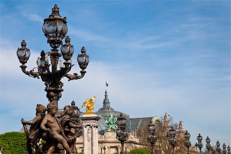 simsearch:400-06924255,k - Pont Alexandre III is an arch bridge that spans the Seine, widely regarded as the most ornate, extravagant bridge in Paris. Stock Photo - Budget Royalty-Free & Subscription, Code: 400-04348130