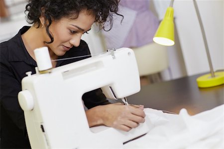 self-employed (female) - Young hispanic female dressmaker using sewing machine. Horizontal shape, side view, waist up Stock Photo - Budget Royalty-Free & Subscription, Code: 400-04340615