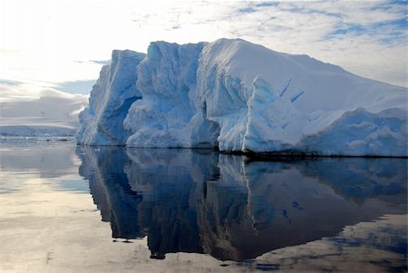 iceberg floating in the ocean, reflected in water Stock Photo - Budget Royalty-Free & Subscription, Code: 400-04341388