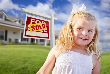 simsearch:700-03508131,k - Cute Smiling Girl in Front Yard with Sold For Sale Real Estate Sign and House. Stock Photo - Budget Royalty-Free & Subscription, Code: 400-04341910