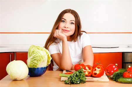 simsearch:400-05744780,k - beautiful caucasian woman preparing salad in the kitchen. Stock Photo - Budget Royalty-Free & Subscription, Code: 400-04354017