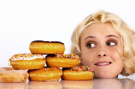 simsearch:400-05106591,k - Woman stares wantingly at a donut Stock Photo - Budget Royalty-Free & Subscription, Code: 400-04355189