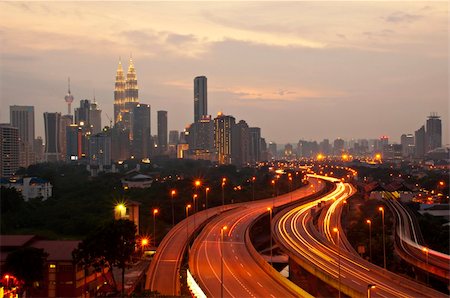 This scenario Kuala Lumpur twin towers, taken with slow shutter speed to get the light trail from the highway traffic in the evening. Stock Photo - Budget Royalty-Free & Subscription, Code: 400-04355434