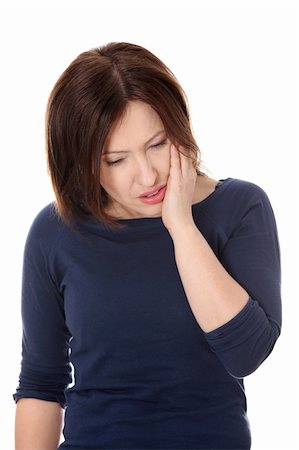 Attractive woman in her 40s pressing her bruised cheek with a painful expression as if she's having a terrible tooth ache. Stock Photo - Budget Royalty-Free & Subscription, Code: 400-04356019