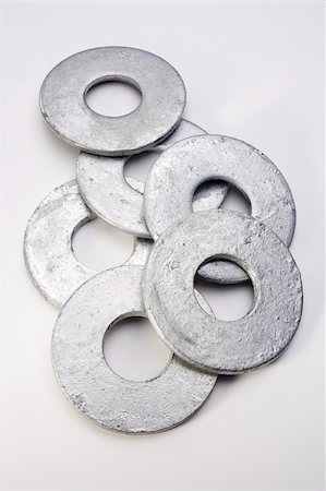 simsearch:400-05240852,k - Pile of flat silver washers on a white background. Stock Photo - Budget Royalty-Free & Subscription, Code: 400-04357516