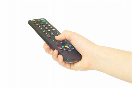 remote control in hand isolated on white background Stock Photo - Budget Royalty-Free & Subscription, Code: 400-04351004