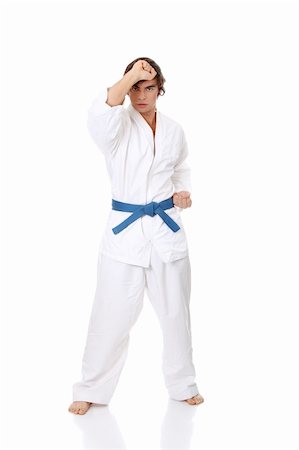 simsearch:400-04347301,k - Karate. Man in a kimono , isolated on the white background Photographie de stock - Aubaine LD & Abonnement, Code: 400-04351588