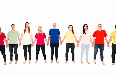 Girls in colored shirts holding hands isolated on white background Stock Photo - Budget Royalty-Free & Subscription, Code: 400-04351782