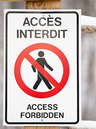 Bilingual access forbiden sign on post in winter Stock Photo - Budget Royalty-Free & Subscription, Code: 400-04352311