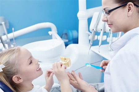 doctor with gloves with child - The dentist and child in the dental office Stock Photo - Budget Royalty-Free & Subscription, Code: 400-04352563