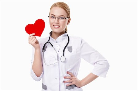 Young doctor holding heart on a white background Foto de stock - Super Valor sin royalties y Suscripción, Código: 400-04352666