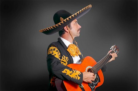 Charro Mariachi playing guitar on black background Stock Photo - Budget Royalty-Free & Subscription, Code: 400-04352851