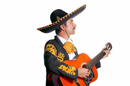 Charro mexican Mariachi playing guitar isolated on white Stock Photo - Budget Royalty-Free & Subscription, Code: 400-04352852