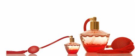 Perfume in a red glass bottles on white background Stock Photo - Budget Royalty-Free & Subscription, Code: 400-04353763