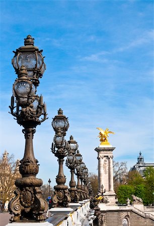 simsearch:400-06924255,k - Pont Alexandre III is an arch bridge that spans the Seine, widely regarded as the most ornate, extravagant bridge in Paris. Stock Photo - Budget Royalty-Free & Subscription, Code: 400-04364948