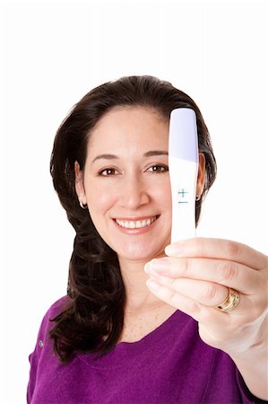 Attractive happy smiling woman finds out she is pregnant of a baby with a positive pregnancy test held in her hand, isolated. Stock Photo - Budget Royalty-Free & Subscription, Code: 400-04365354