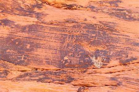 Strange petroglyphs on a rock wall at Valley of Fire State Park in Nevada. Stock Photo - Budget Royalty-Free & Subscription, Code: 400-04365410